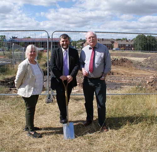 Pictured is Councillors Sandra Peake, David Downes and Steve Fritchley digging in a spade on the Market Close site in Shirebrook