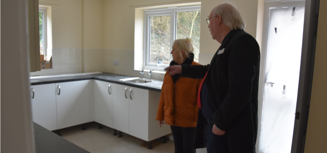 Councillors Steve Fritchley and Sandra Peake looking at kitchen in new property at Whaley Thorns